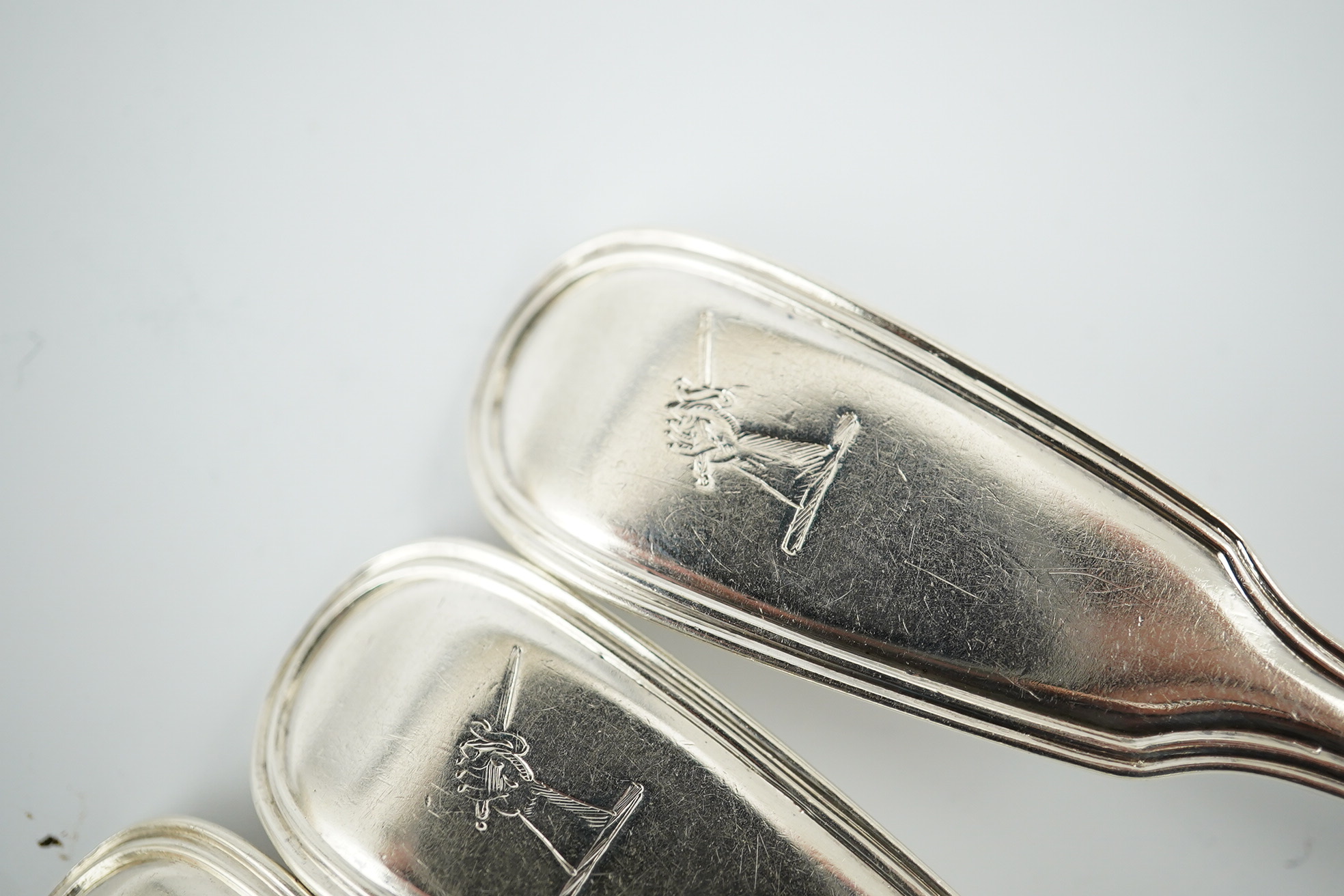 Two sets of six William IV silver fiddle and thread pattern teaspoons, one with engraved crest, William Chawner II, London, 1831 and Mary Chawner, London, 1836